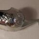 Sugar and sugar shovel in golden silver metal