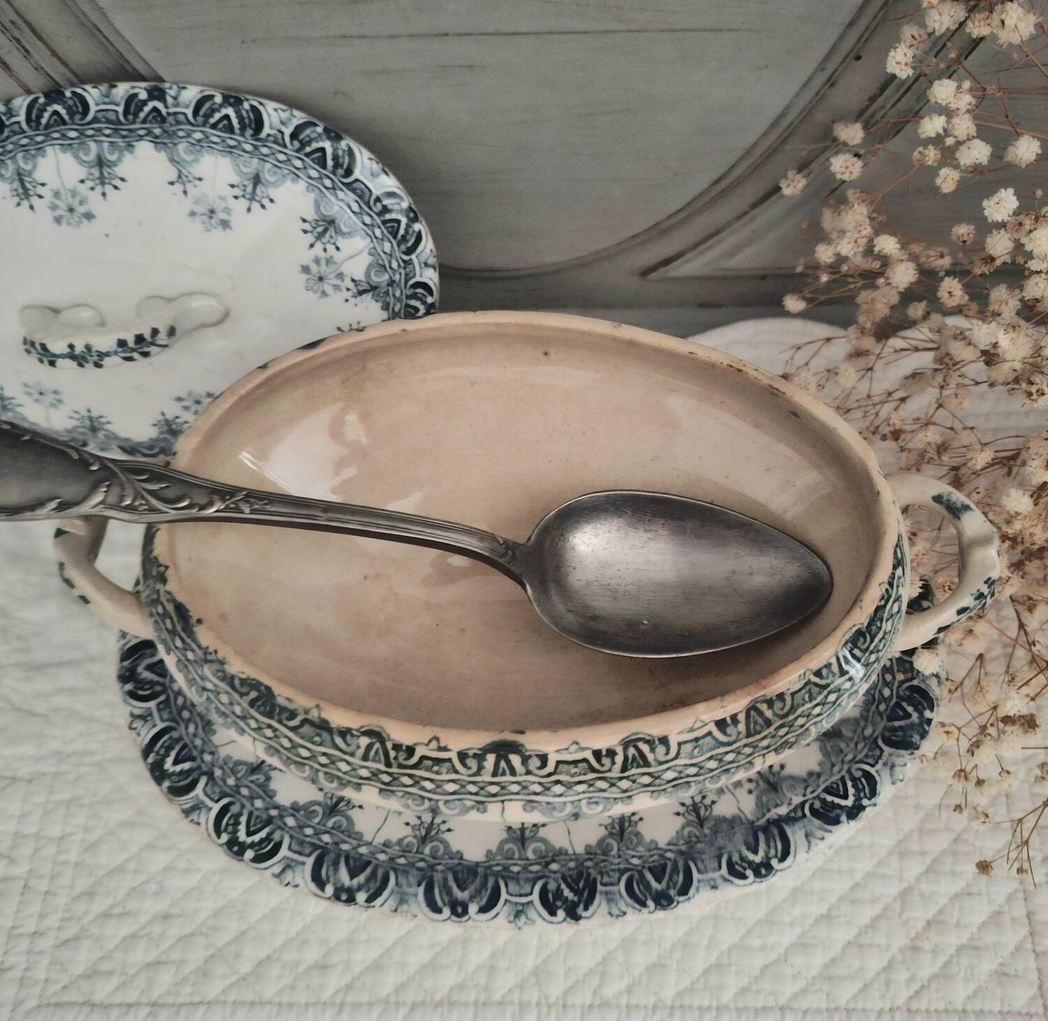 Antique iron earthenware sauceboat on a frame