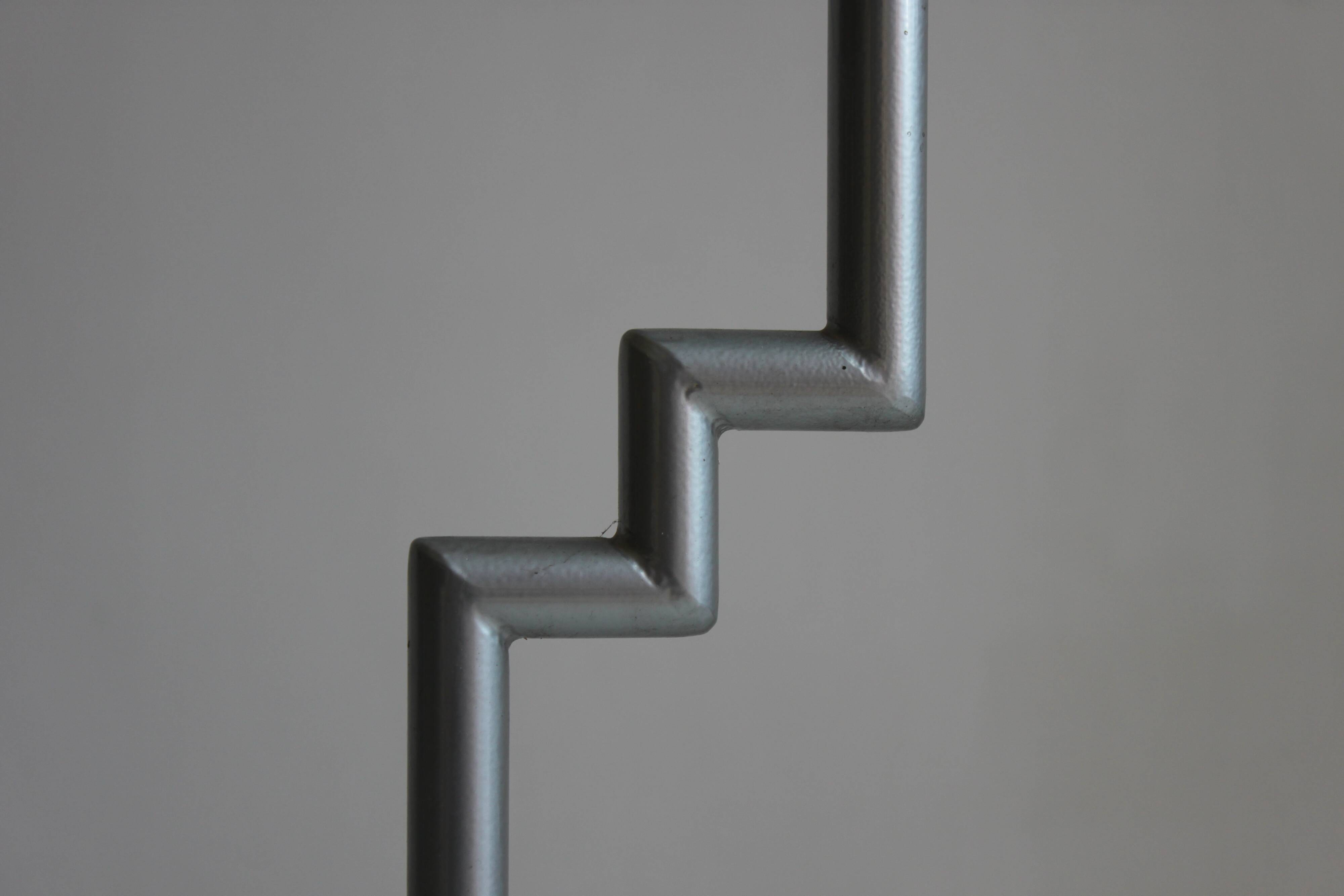 Postmodern round glass  and steel side table, 1980s.