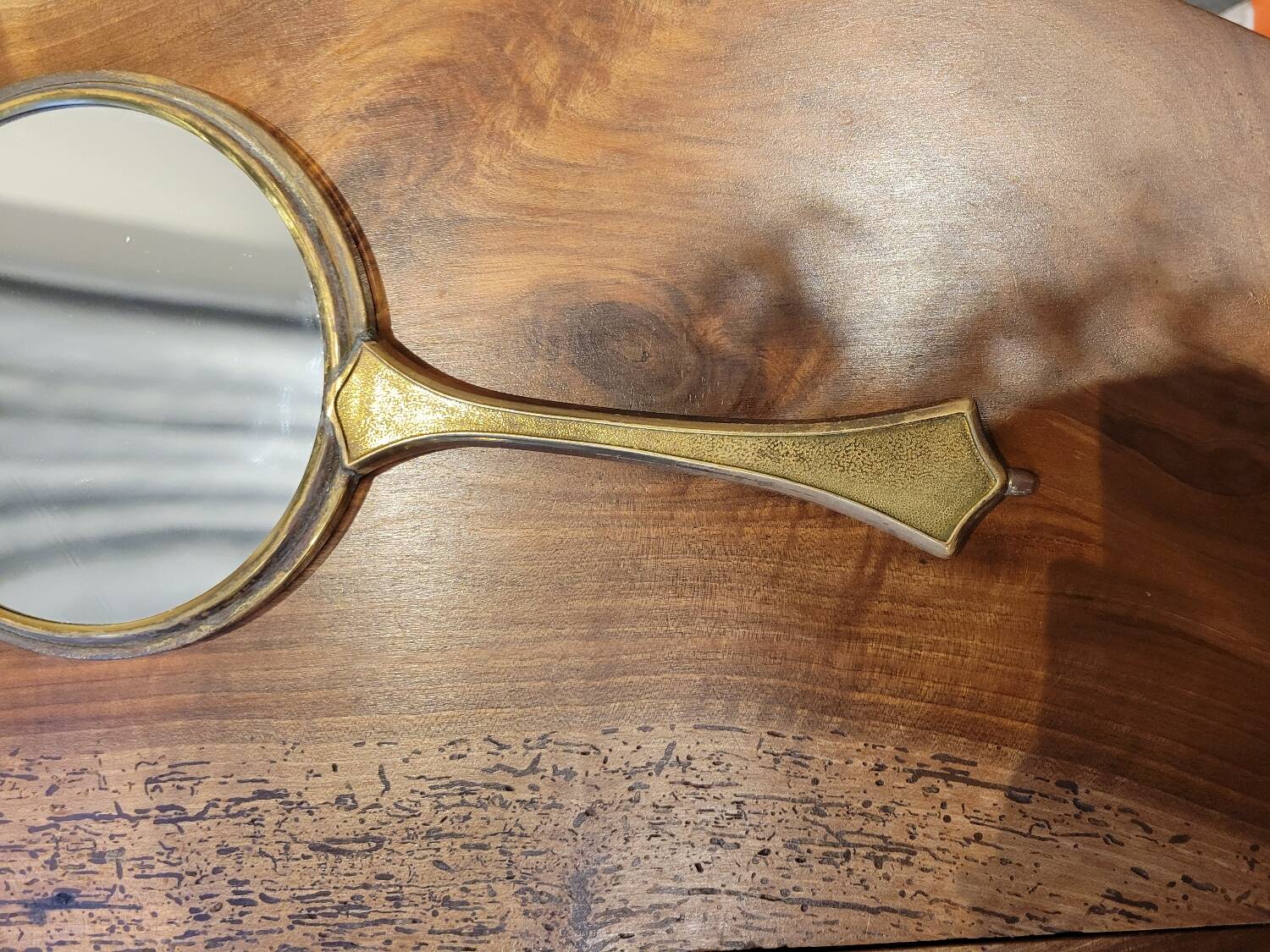 Brass hand mirror with magnifying back