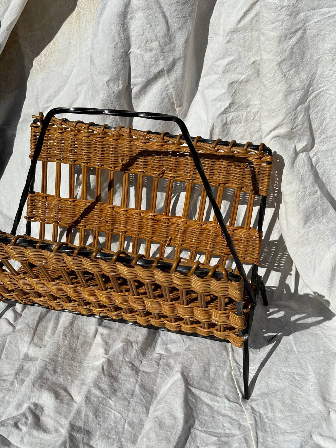 Vintage metal and wicker magazine rack