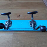 Wall coat holder with two metal pads