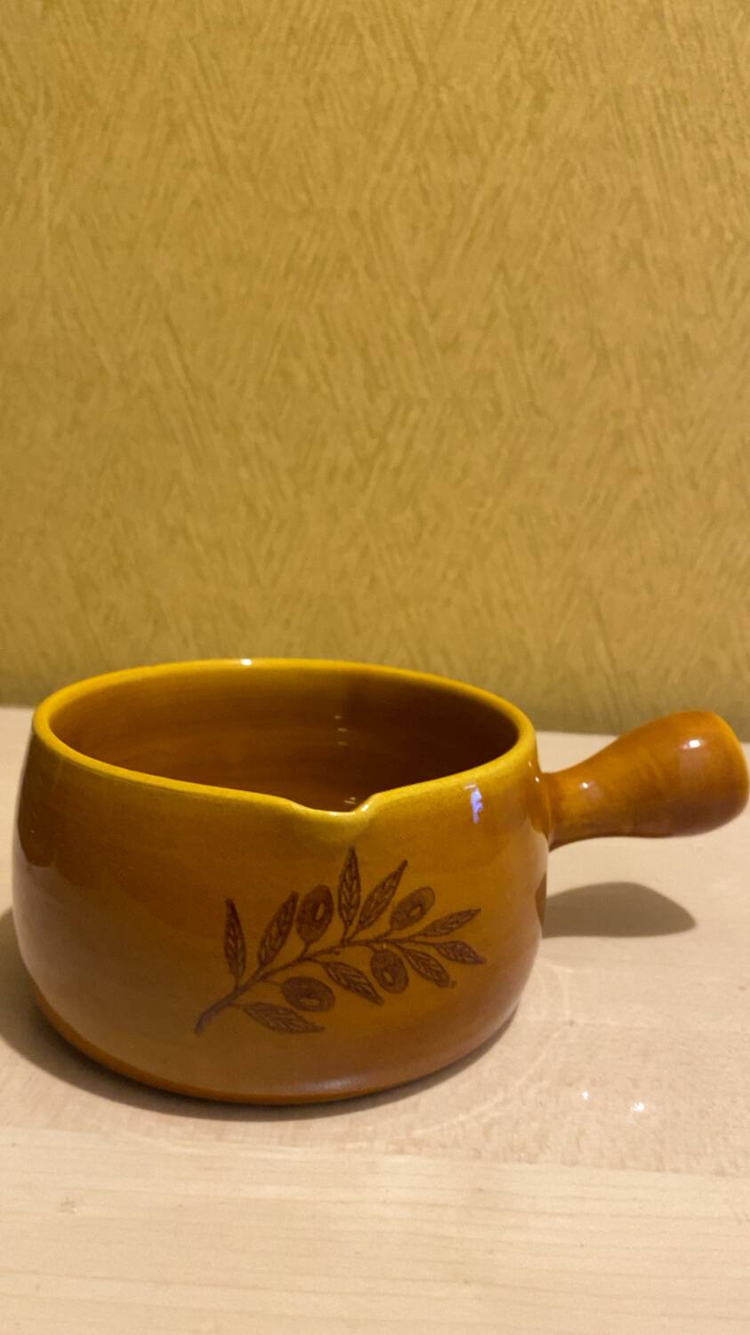 Glazed yellow earthenware fondue pot
