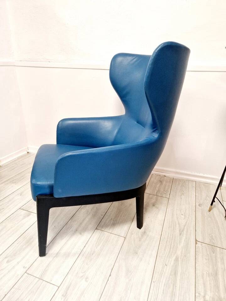 High-back armchair by Rodolfo Dordoni