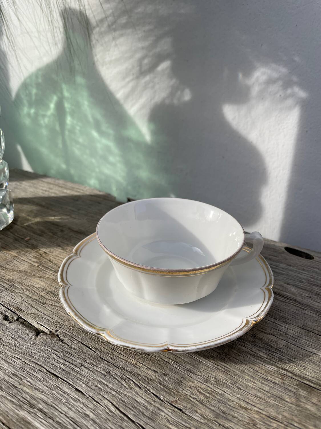 Pair of fine white and gold Limoges porcelain teacups