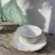 Pair of fine white and gold Limoges porcelain teacups