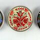 Set of three vintage folk art ceramic wall plates, Czechoslovakia and Romania.