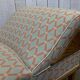 English daybed from the early 20th century in oak, some stains on the fabric