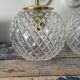 Set of two new electrified chiseled glass globe sconces