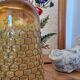 Artisanal blown amber glass vase with integrated honeycomb structure.