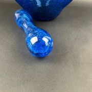 Mortar and pestle in the style of Biot, hard blue.