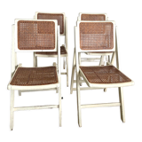 4 folding chairs with wicker seating