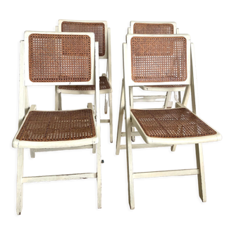 4 folding chairs with wicker seating