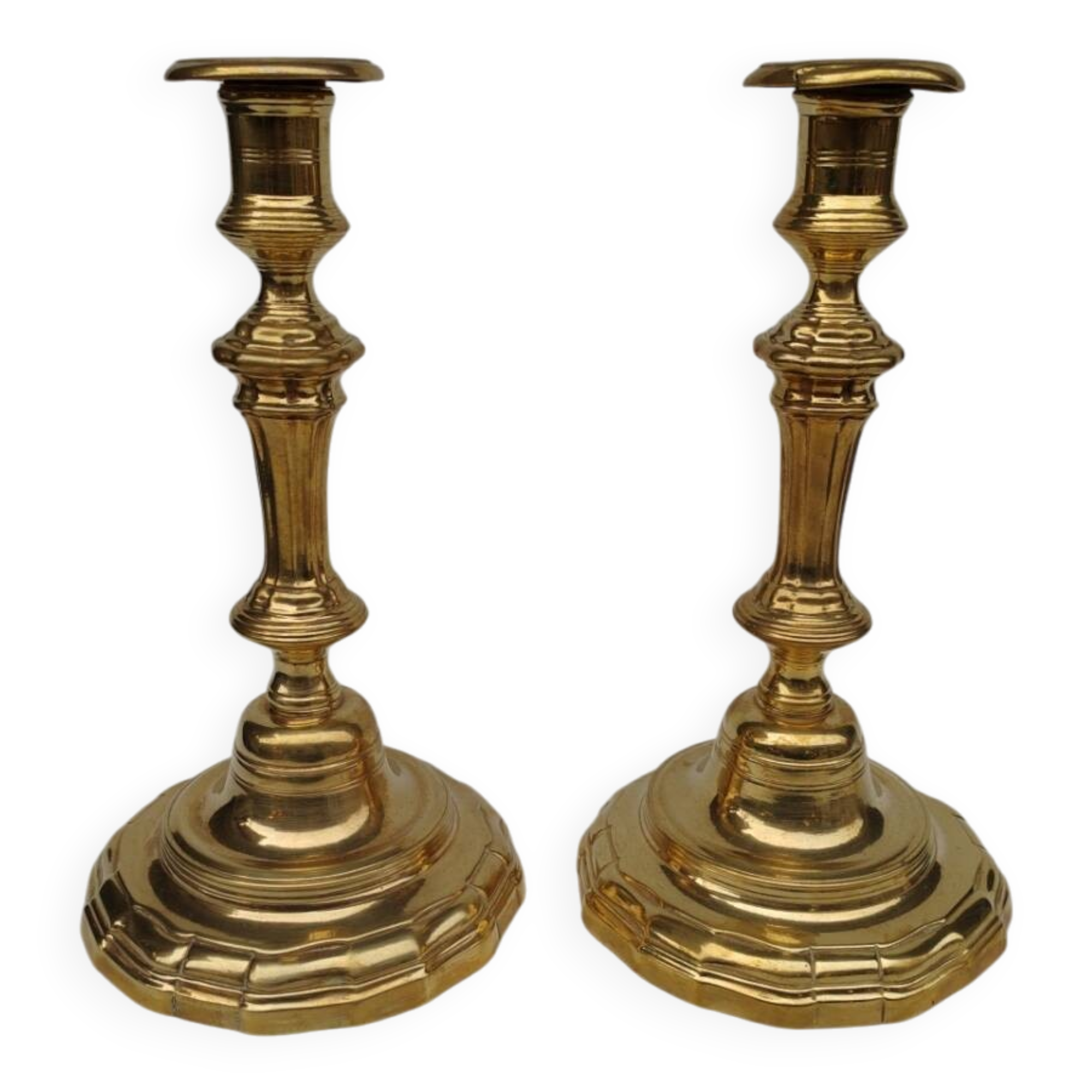 Pair of solid brass candlesticks, early 18th century.