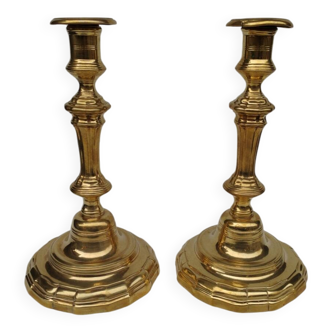 Pair of solid brass candlesticks, early 18th century.