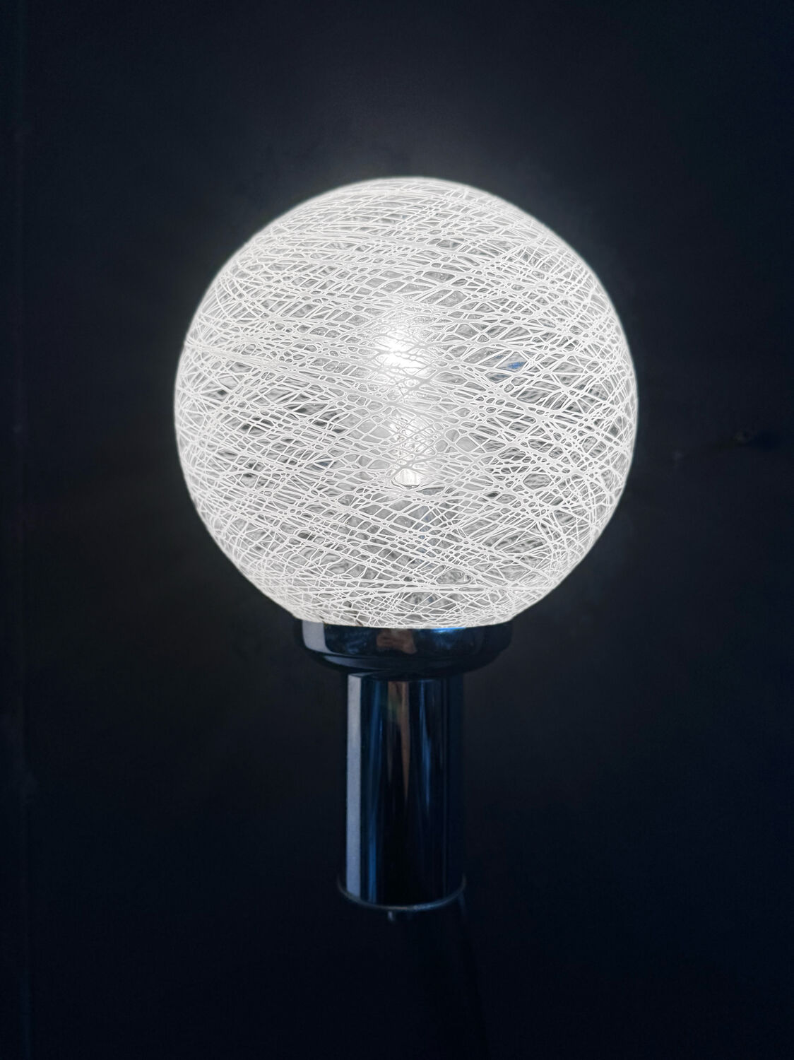 Chrome wall light with blown glass from the 1970s.