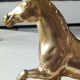 Large vintage horse in exercise figurine on oval base, in polished brass 26 x 19 cm