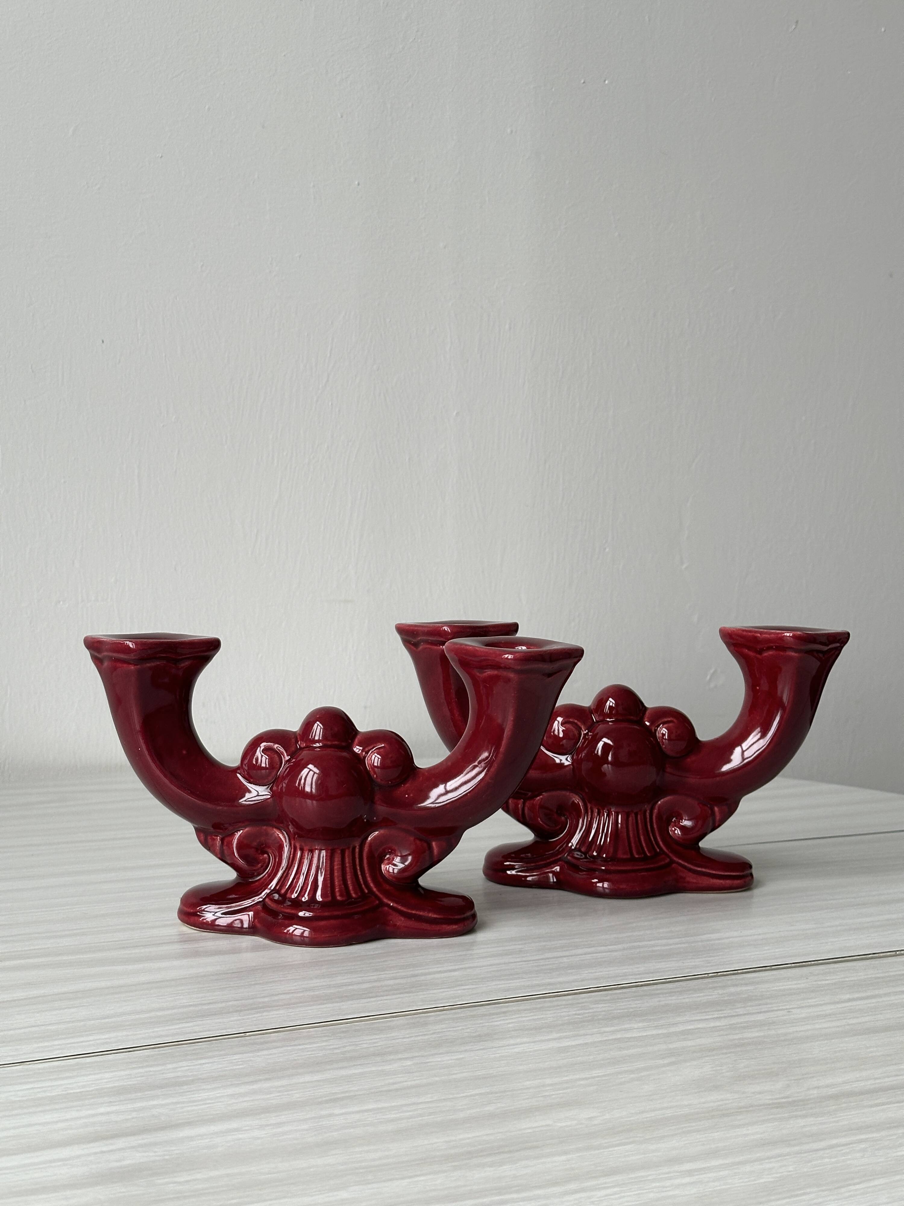 Pair of 1950s burgundy earthenware candlesticks