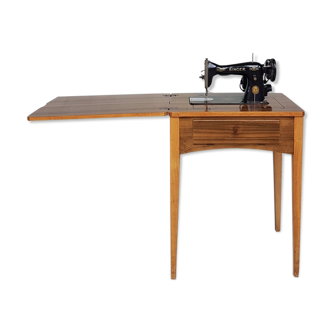 Sewing table with integrated singer machine