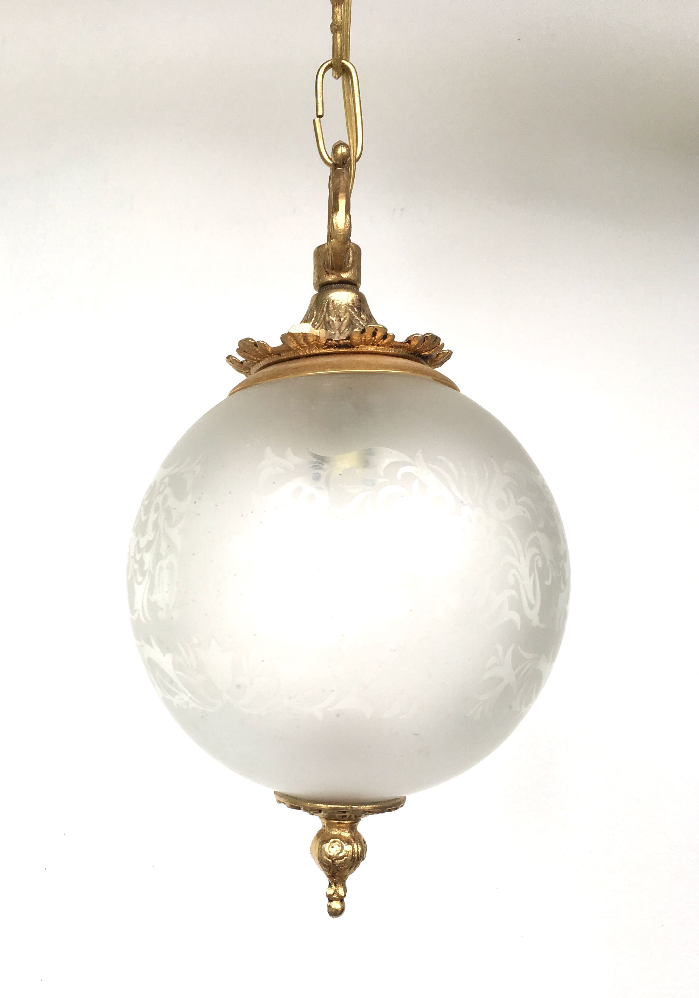Floral globe and gold metal hanging lamp