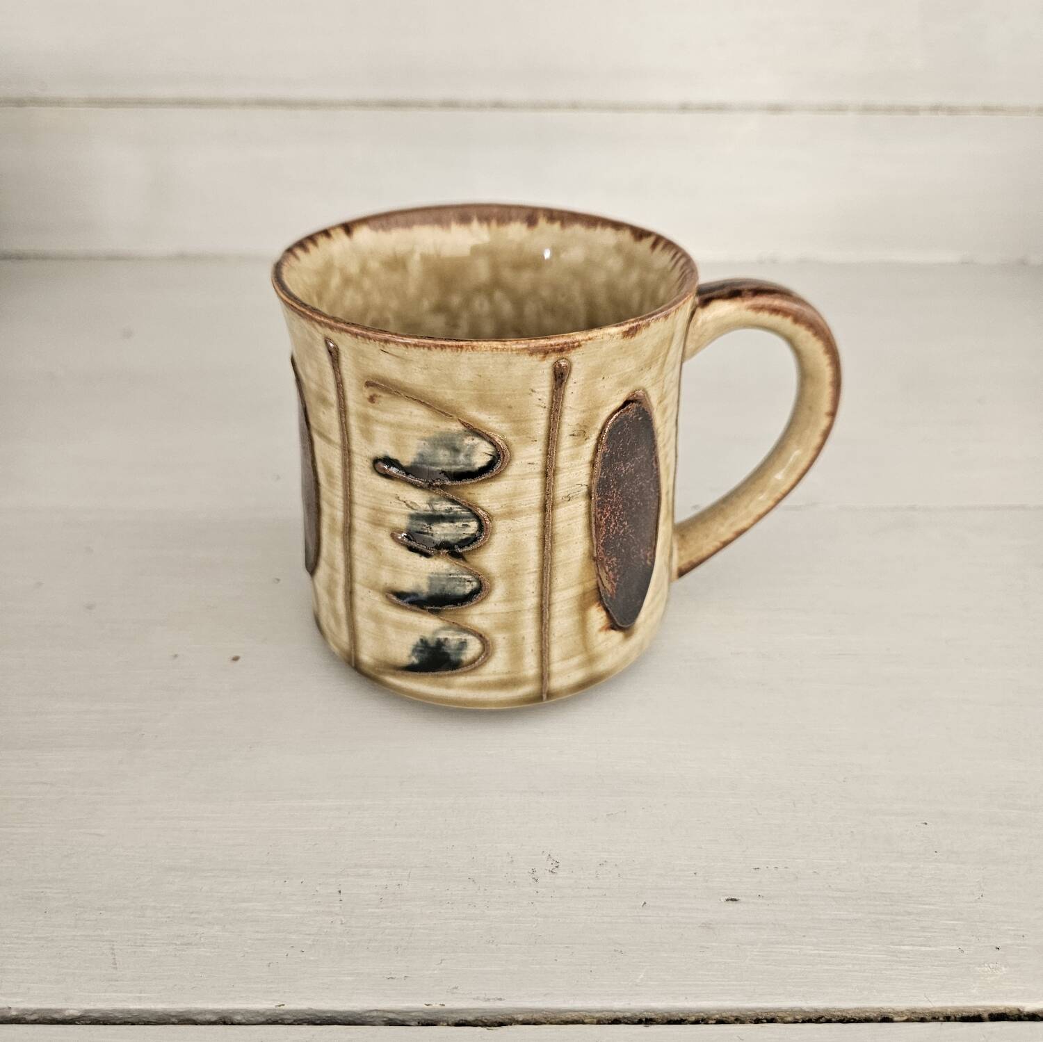 Set of 4 ceramic mugs, glazed stoneware, assorted vintage designs.