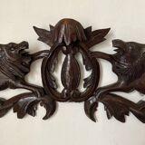 Antique carved wooden pediment with lions and medallion