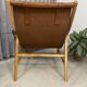 Colonial armchair in leather and wood