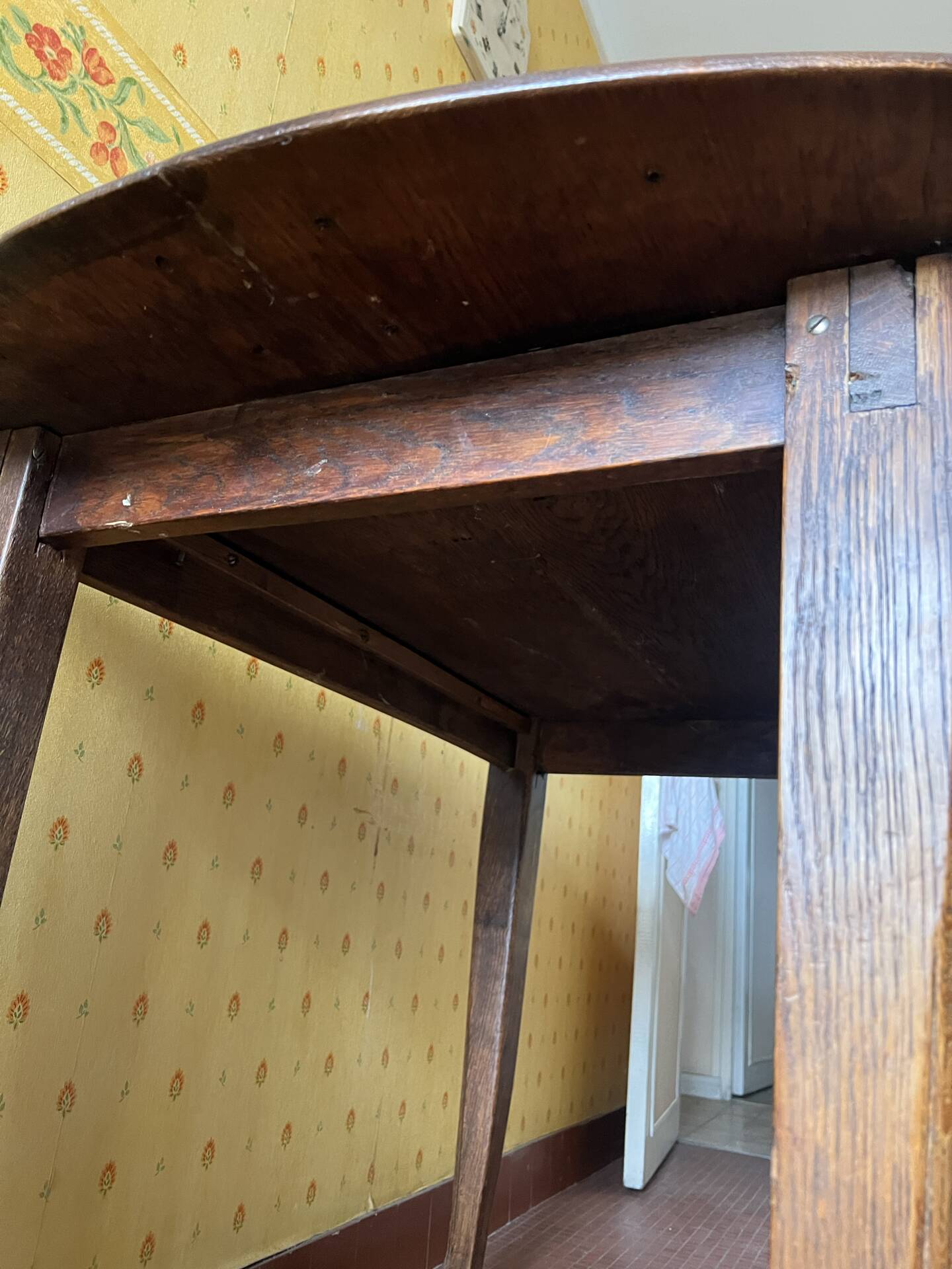 Vintage antique oak table with ornate legs.