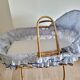 Rattan bassinet with support