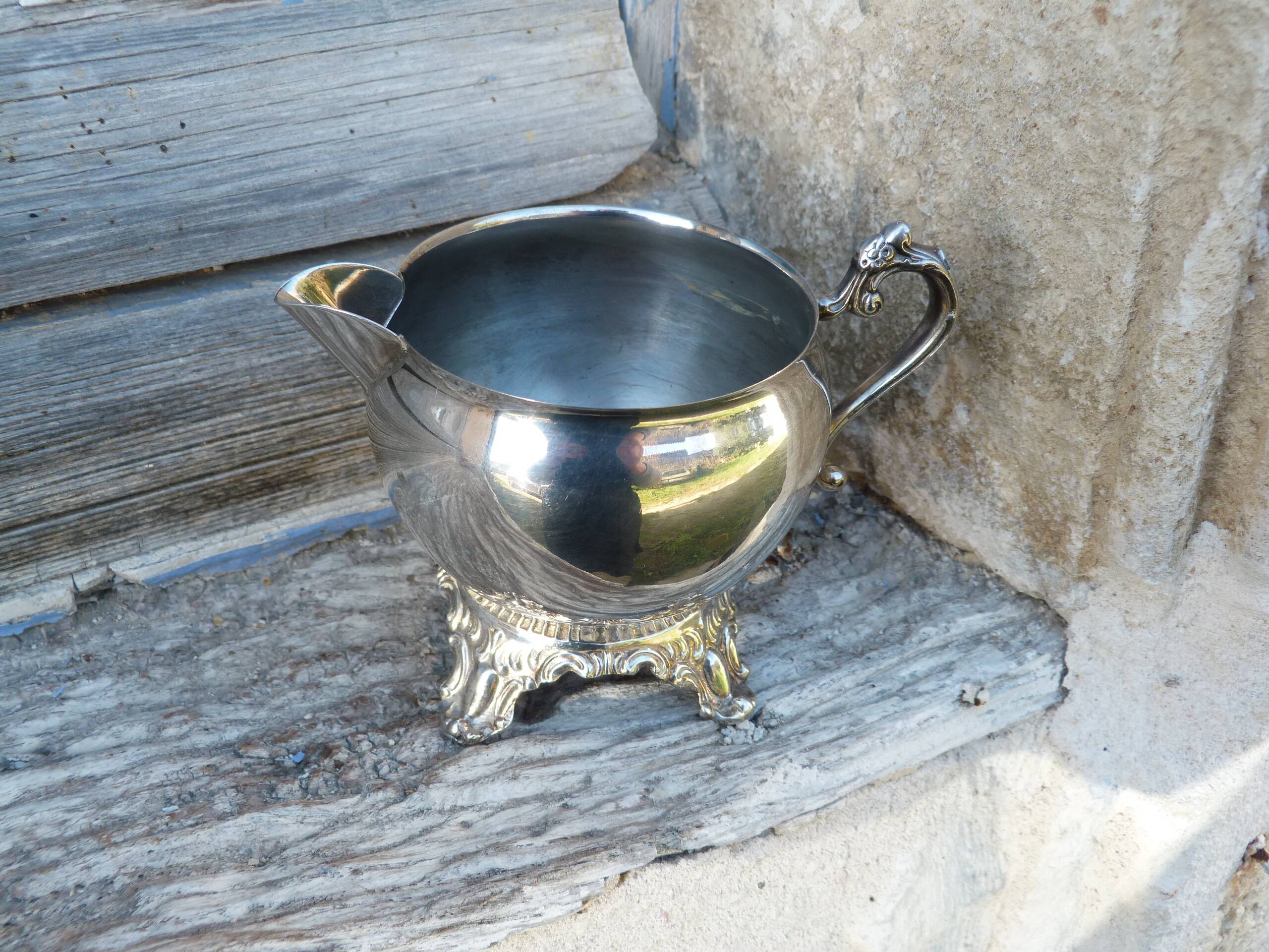 Old silver-plated metal milk or cream jug