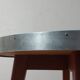 Vintage metal and teak side table from the 1950s.