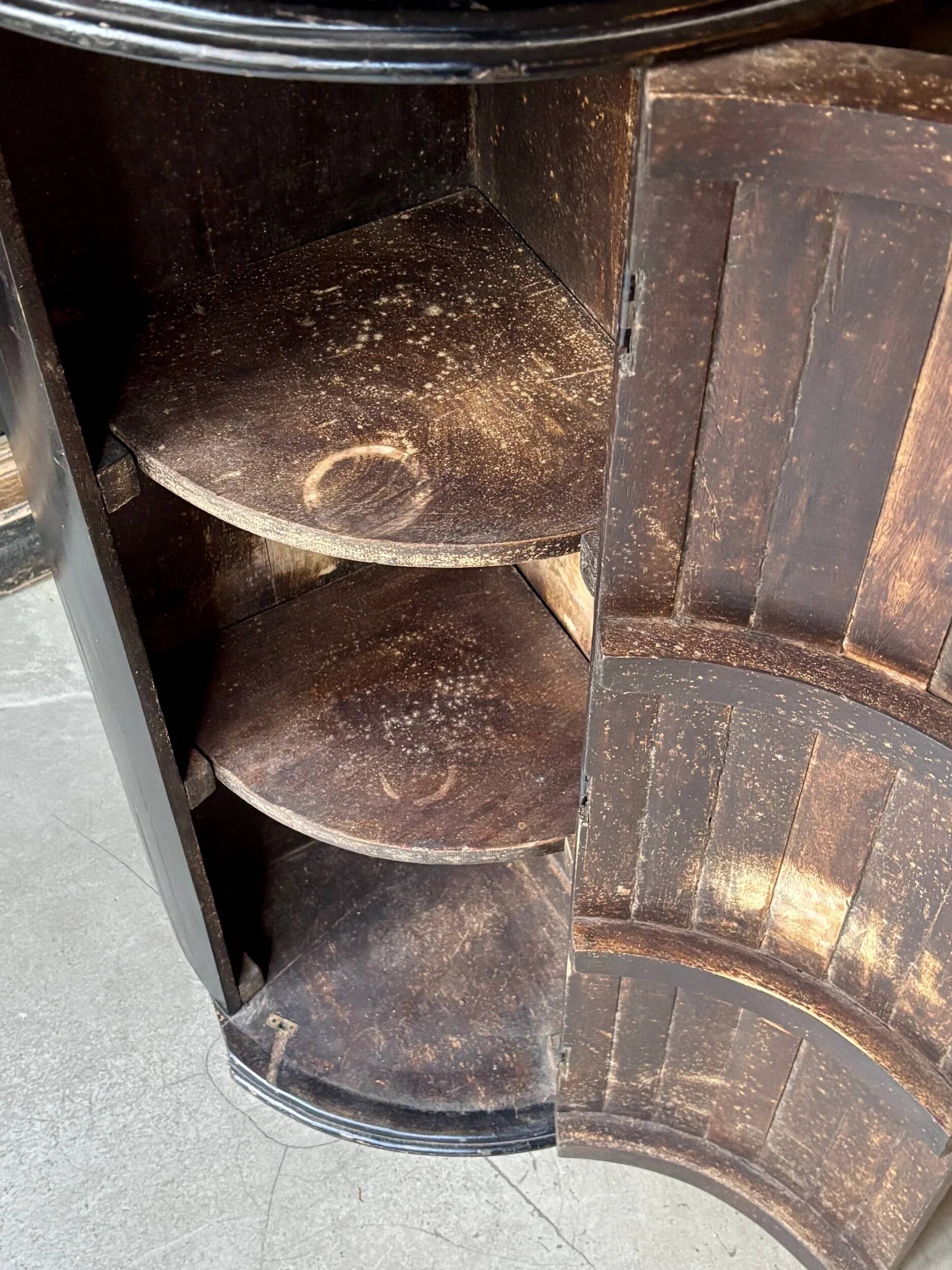 English corner cabinet in blackened wood, 19th century.