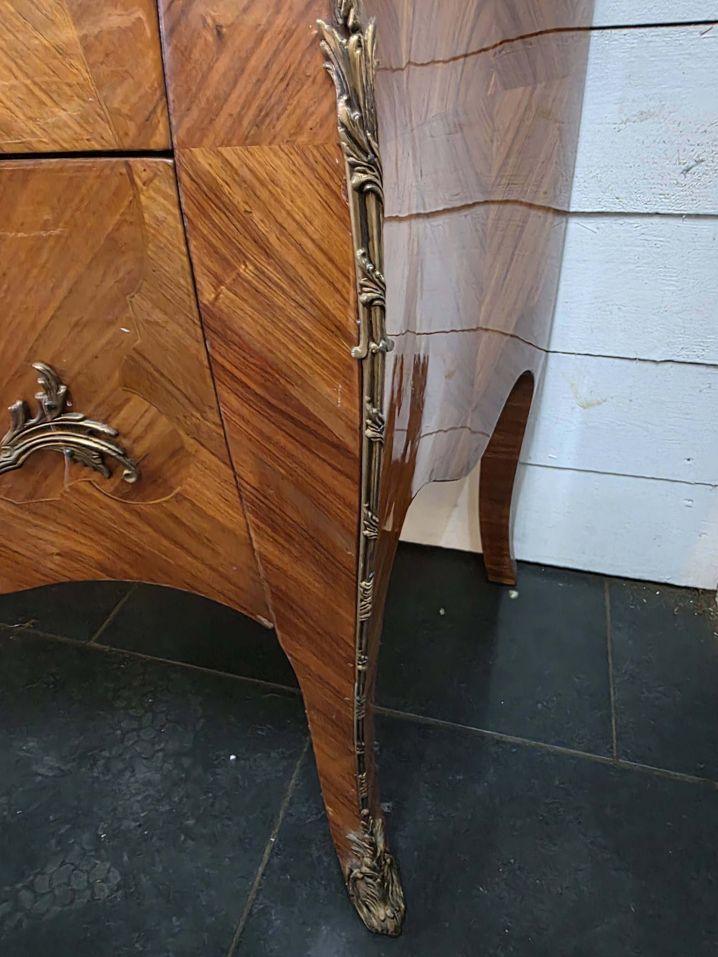 Louis XV style curved chest of drawers in marquetry