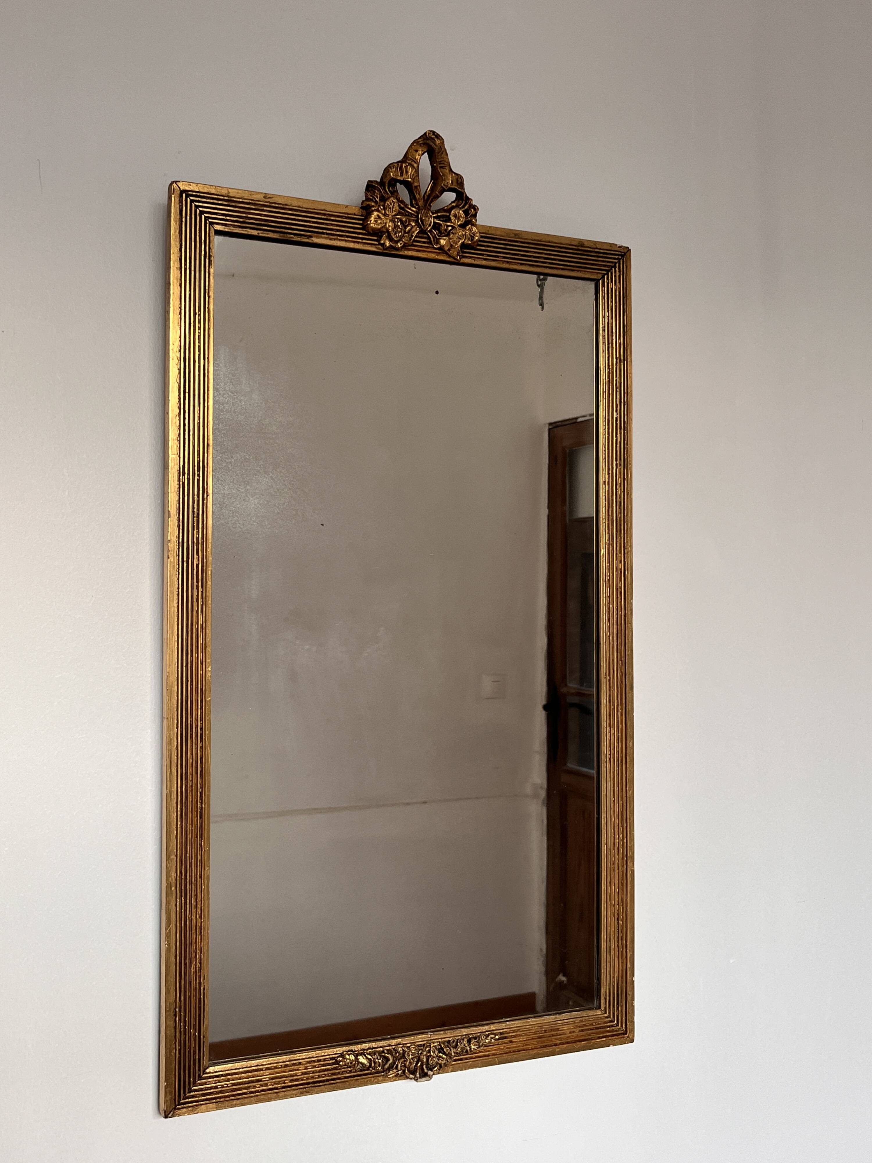 Golden mirror in Louis XVI style