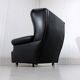 Fauteuil à oreilles en cuir noir sur roulettes années 1960