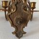 Pair of antique wall-mounted brass candle holders