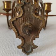 Pair of antique wall-mounted brass candle holders