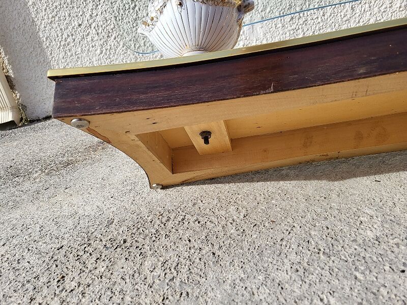 Italian coffee table with glass top, wooden base, and porcelain legs