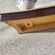 Italian coffee table with glass top, wooden base, and porcelain legs