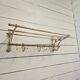 Wall-mounted coat rack with brass hat rack