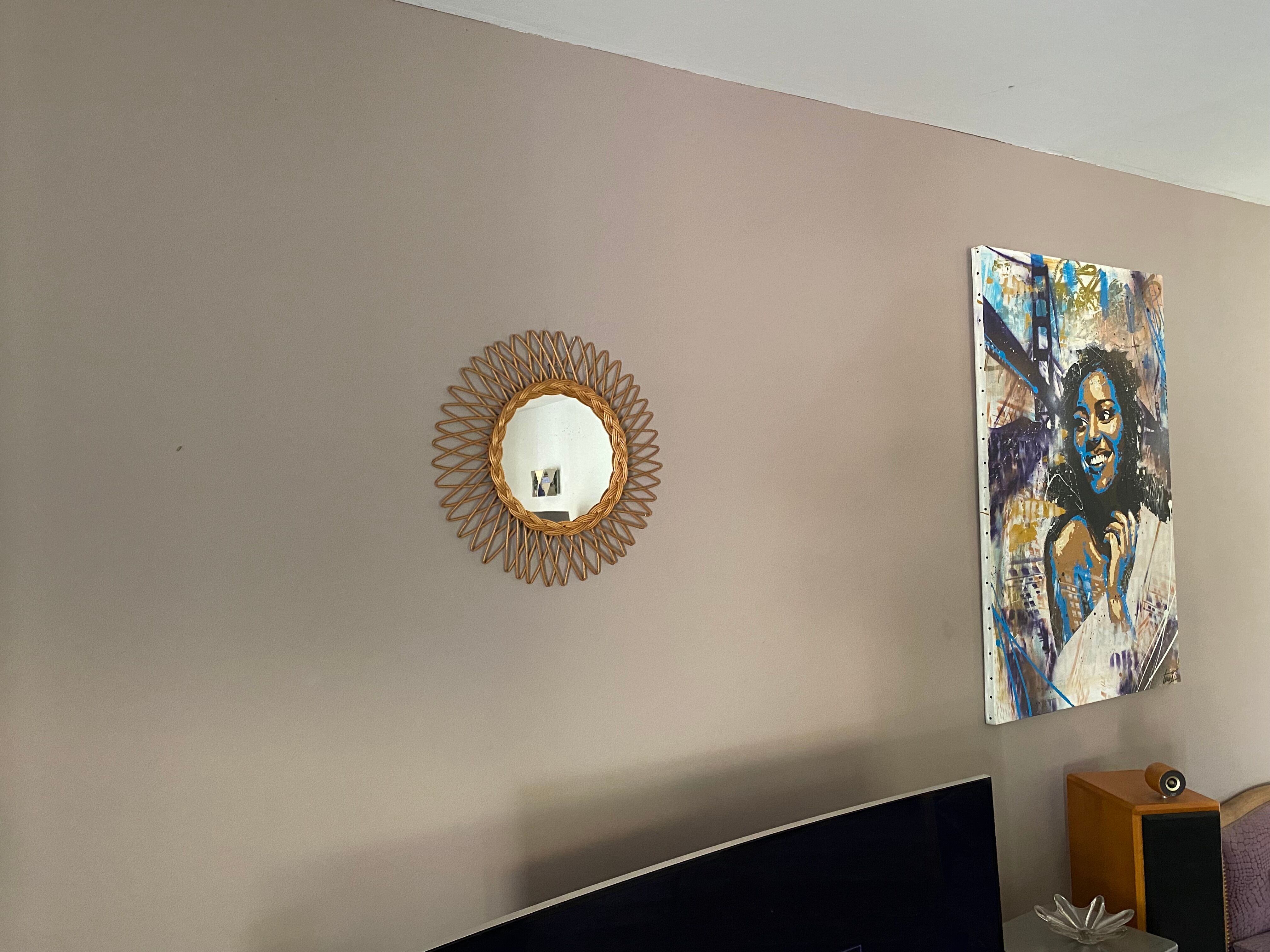 Sun mirror in braided rattan. 1960. 50cm.