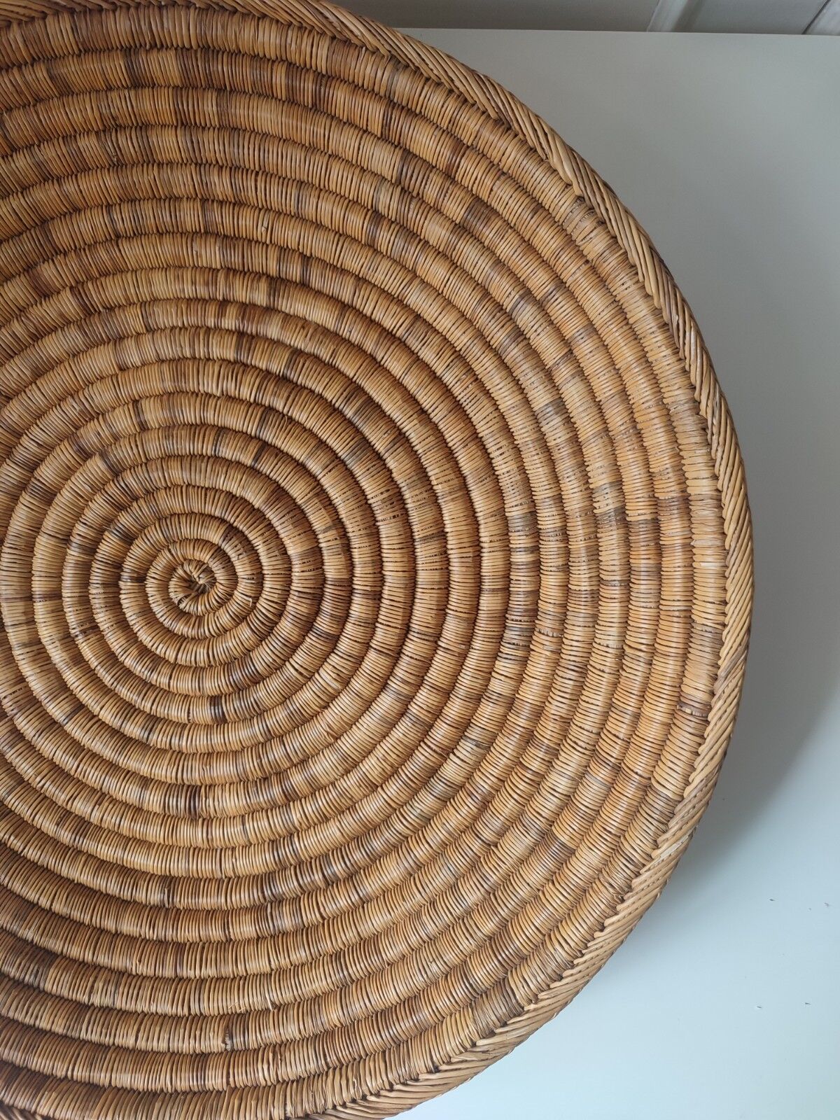 Ethnic plateau in woven palm leaf