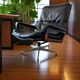 Vintage black leather armchair / Andre Vandenbeuck single seater armchair