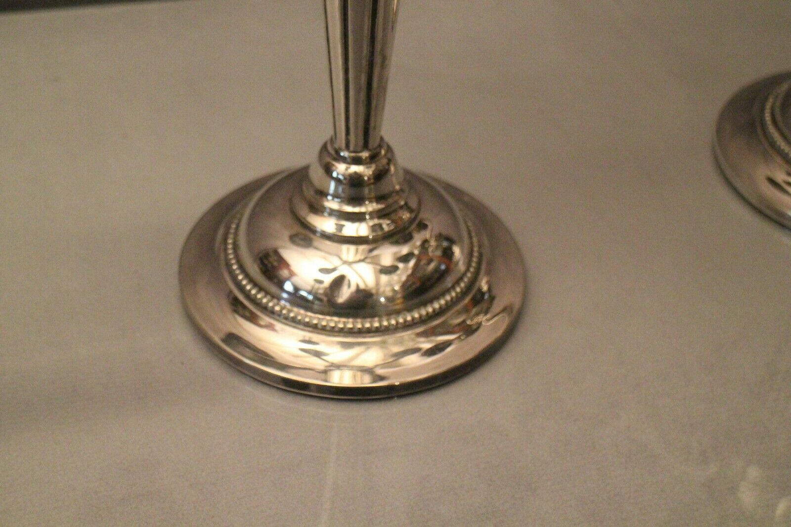 Pair of large candlesticks with 4 silver metal lights in Louis XVI style
