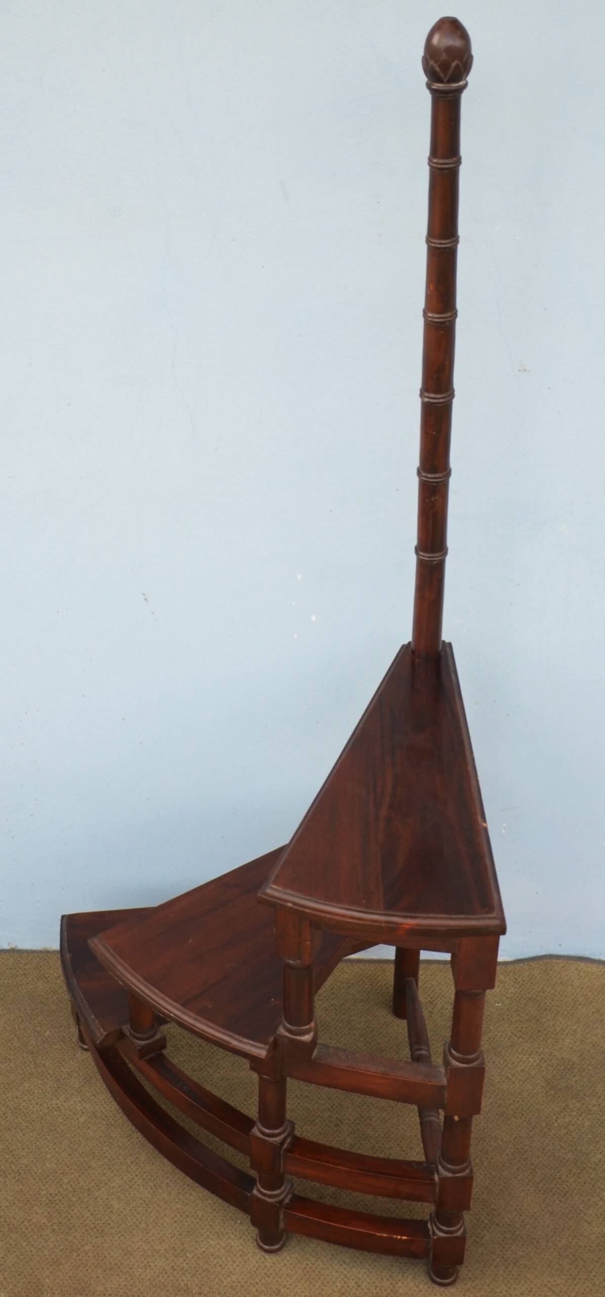 Spiral staircase for library made of mahogany wood
