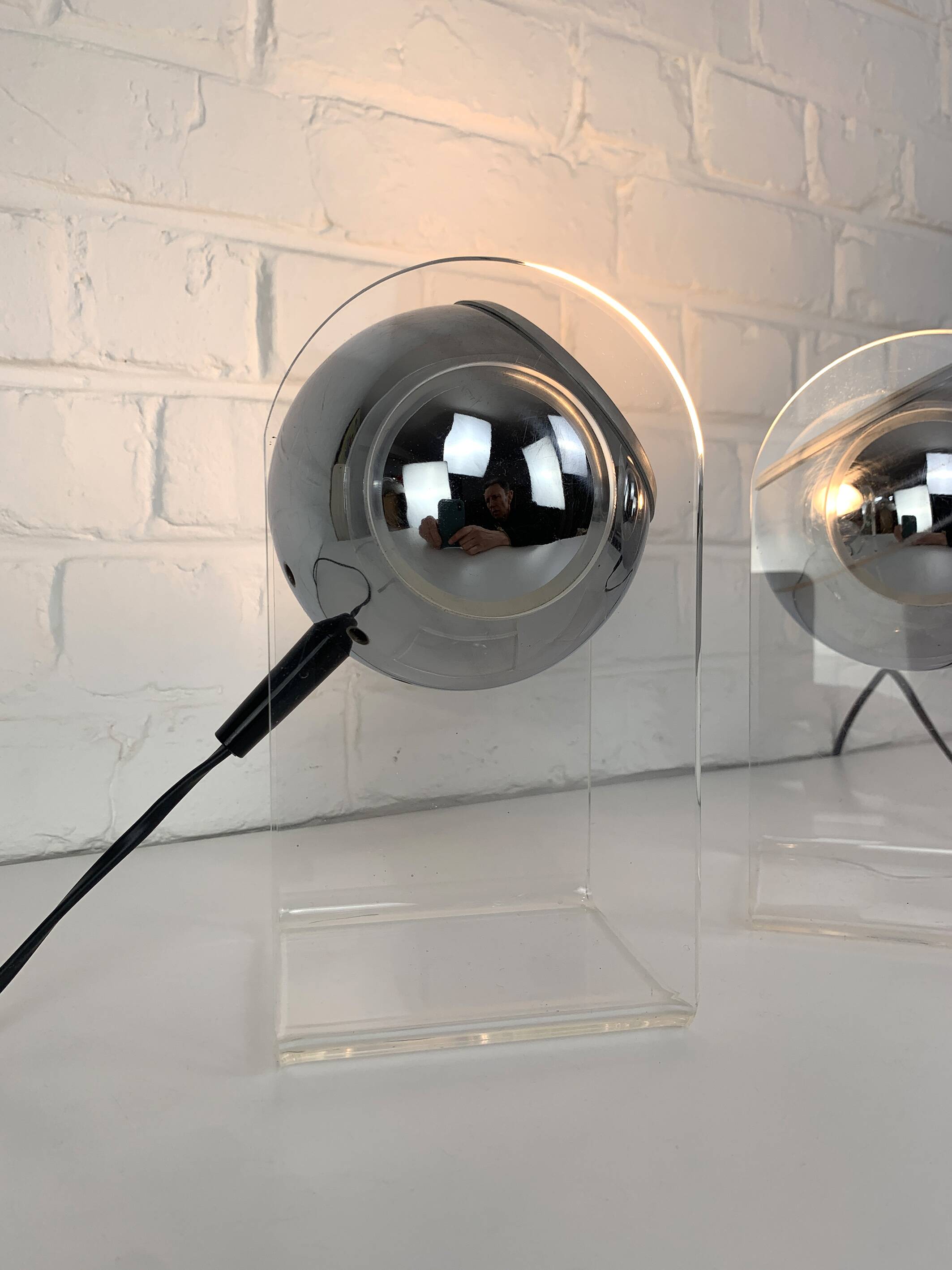 Pair of space age chrome plexiglass sphere table lamps from the 70s