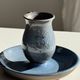 Vintage hand-held candlestick in blue glazed stoneware with floral decoration by Poterie Millian.