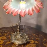 old art nouveau bronze lamp 30x25 with opalescent tulip red interior very rare