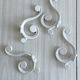 Set of 4 white lacquered metal hooks,