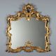 Miroir ancien en bois sculpté et doré, Italie, début XXe siècle